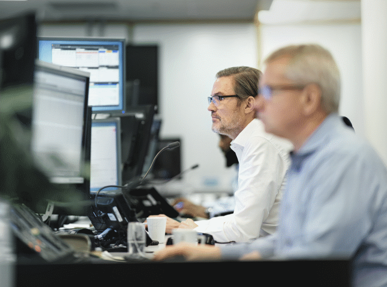 Two men working at their computers